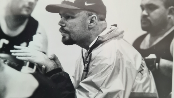 A black and white image of Tony Howe coaching