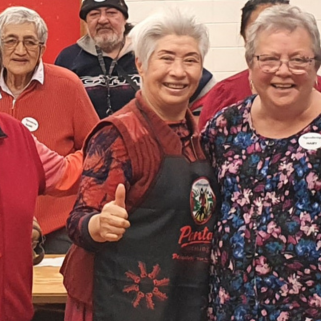Staff Member Mary with a group of attendees at a workshop