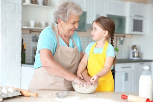  Grandma and granddaughter baking together 